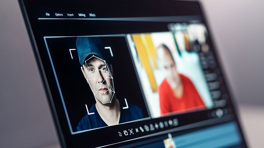 Computer screen showing editing software editing a photo of a man's face